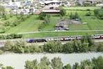 Re 460 031 mit Ceneri Werbung zieht am 23.7.18 ihren IC 2000 Richtung Brig.